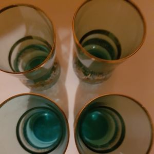 Beautiful rimmed and etch in gold. Blue vintage shot glasses